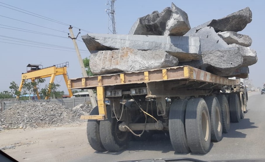 a truck carrying granite stones.jpg